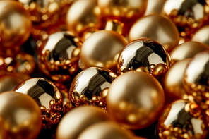 close up view of shiny golden Christmas balls