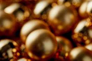 blurred shiny golden Christmas balls background