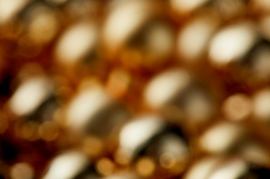 blurred shiny golden Christmas baubles background