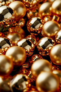 selective focus of shiny golden Christmas decorative balls
