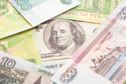 selective focus of russian rubles and dollar banknote