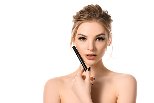 naked beautiful blonde woman with makeup and black nails holding mascara isolated on white