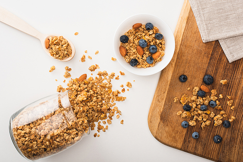 top view of delicious granola with nuts, blueberry and dried apricots isolated on white