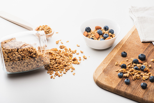 delicious granola with nuts and blueberry on white background