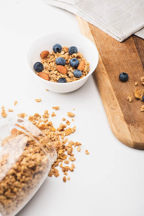 delicious granola with nuts and blueberry on white background