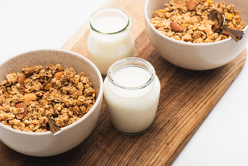 delicious granola with nuts and yogurt isolated on white