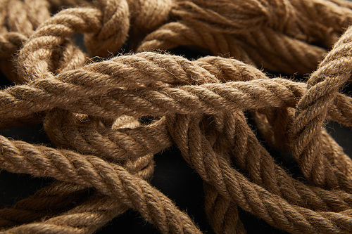 close up view of rope on black background