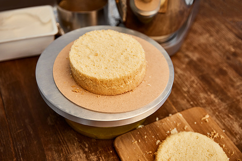 Wooden table with sponge cake