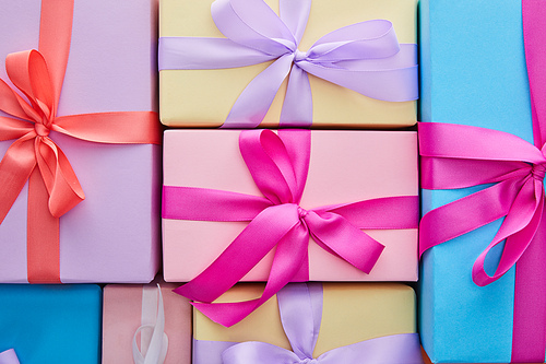 flat lay with multicolored gift boxes with ribbons and bows