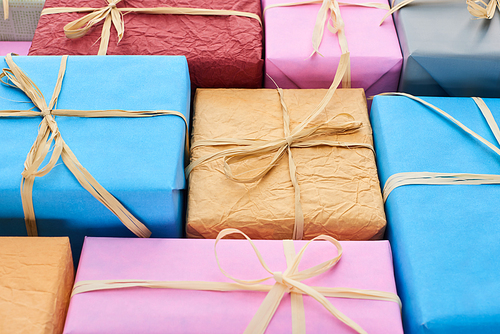 colorful and wrapped gifts with decorative bows