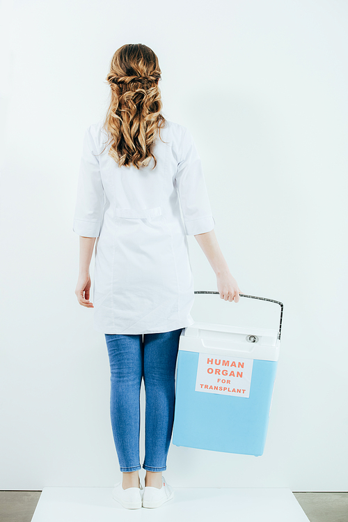 back view of doctor in white coat holding bucket for transplantation isolated on white