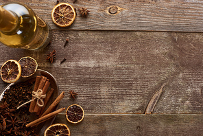 top view of white wine near spices on wooden rustic table