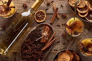 top view of delicious pear mulled wine with spices on wooden rustic table