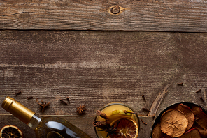 top view of traditional pear mulled wine with spices on wooden rustic table with copy space