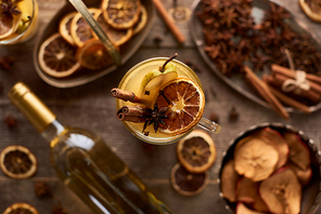 selective focus of traditional pear mulled wine with spices in glass