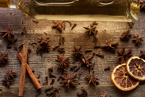 top view of white wine and spices on wooden rustic table