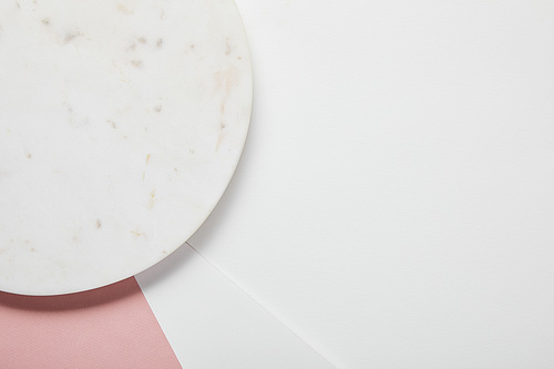 top view of plate on white pink surface