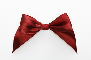 top view of satin burgundy bow isolated on white