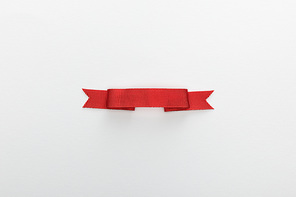 top view of red decorative ribbon isolated on white