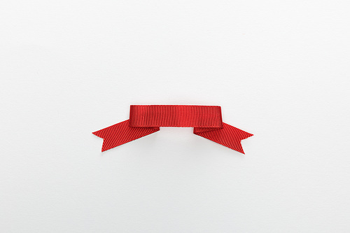 top view of red decorative ribbon isolated on white