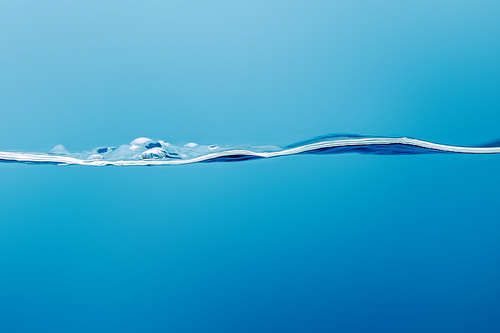 transparent pure calm water on blue background