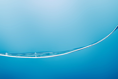 smooth transparent pure water wave on blue background