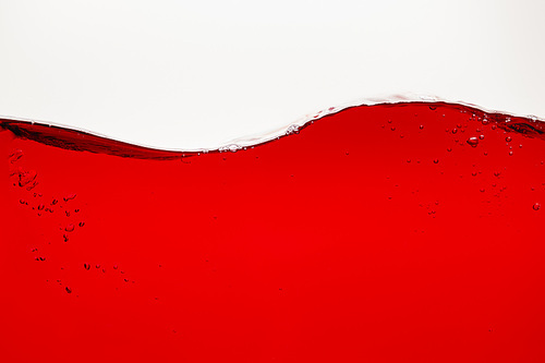 wavy red bright liquid with bubbles isolated on white