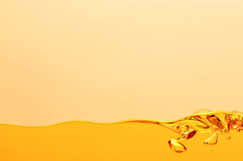 yellow bright liquid with bubbles isolated on yellow