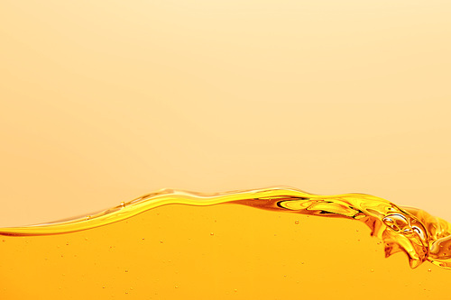 smooth yellow bright liquid with wave isolated on yellow