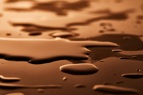 water puddles and drops on brown background