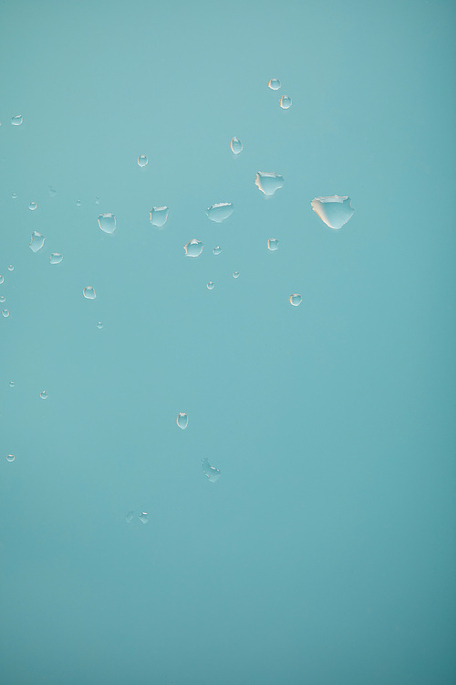 clear water drops on blue background