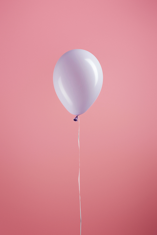 purple decorative festive balloon on pink background