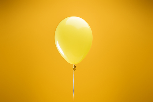 festive bright minimalistic decorative balloon on yellow background
