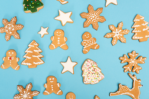 top view of winter gingerbread cookies on blue background