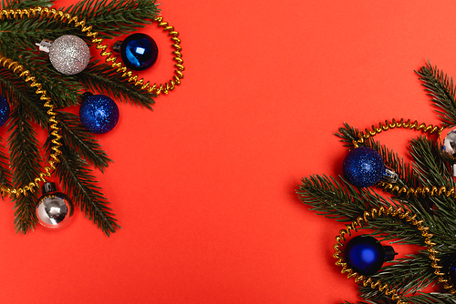 top view of decorated Christmas tree on red background