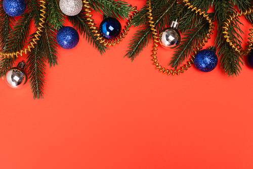 top view of decorated Christmas tree on red background