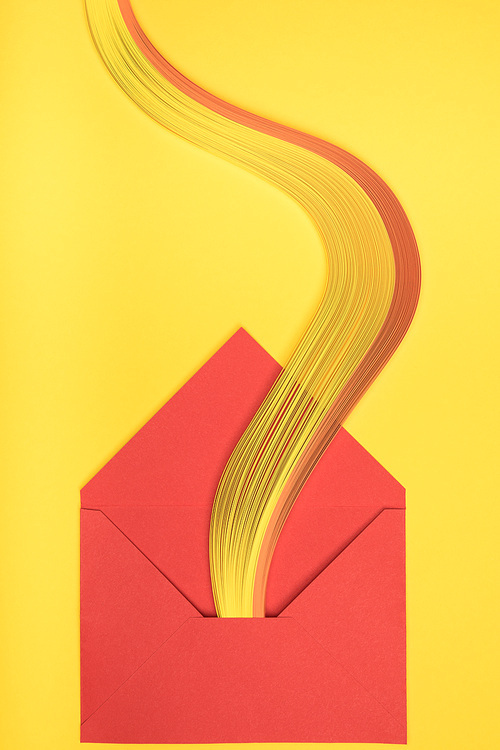 top view of open red envelope with  on yellow background