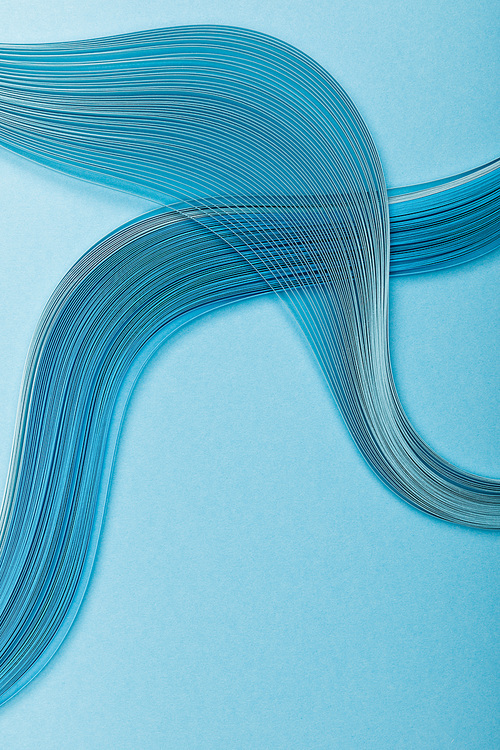 top view of blue abstract paper lines on blue background