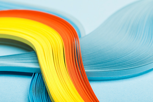 close up of yellow, orange and blue abstract lines on blue background