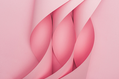 top view of pink paper swirls on pink background