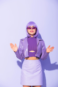 smiling young woman dressed in doll style on violet colorful background
