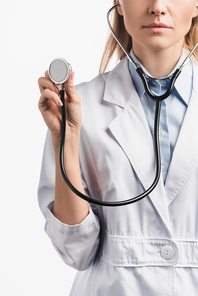 cropped view of nurse in white coat holding stethoscope isolated on white
