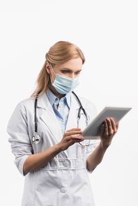nurse in medical mask and white coat using digital tablet isolated on white