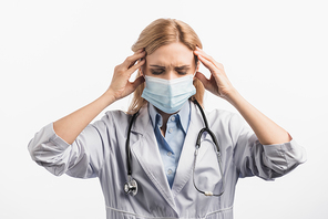 tired nurse in medical mask and white coat having headache isolated on white