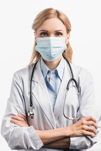 doctor in medical mask and white coat standing with crossed arms isolated on white