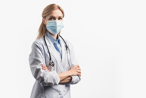 nurse in medical mask and white coat standing with crossed arms isolated on white