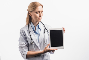 nurse in white coat holding tablet with blank screen isolated on white