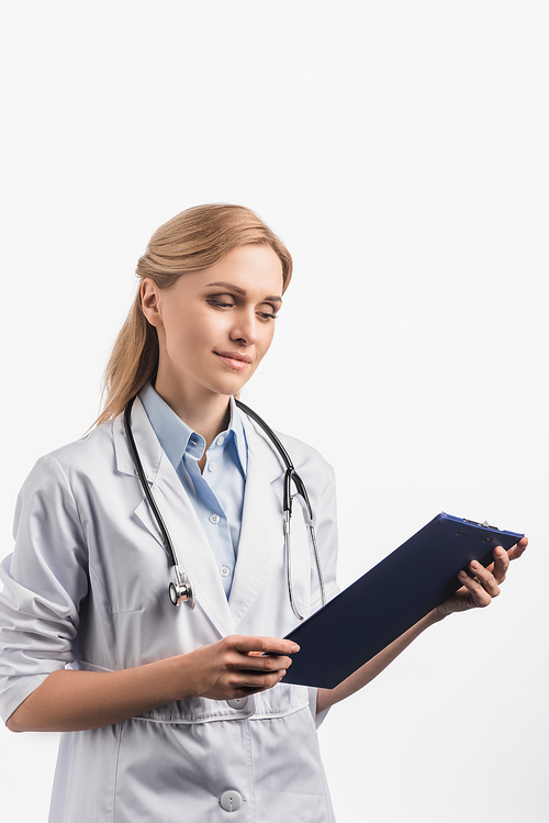 nurse in white coat looking at clipboard isolated on white
