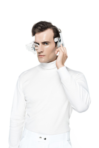 Cyborg in white clothes, digital eye lens and headphones  isolated on white