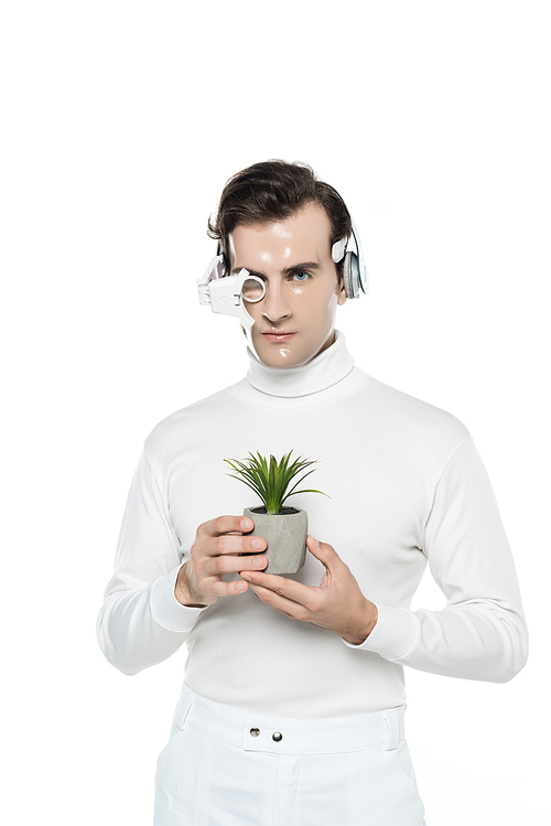 Cyborg man in headphones and digital eye lens holding potted plant isolated on white